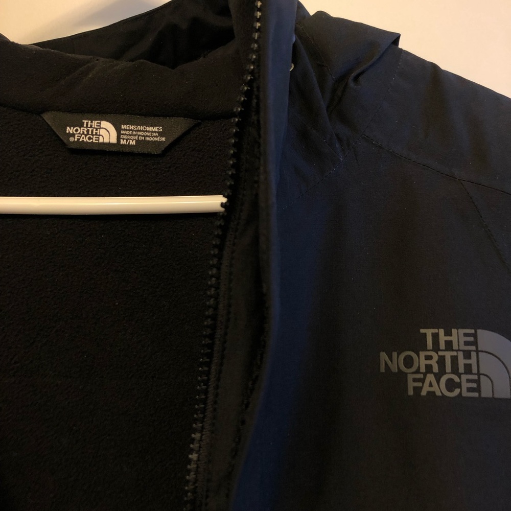 Black North Face jacket. Weather proof.